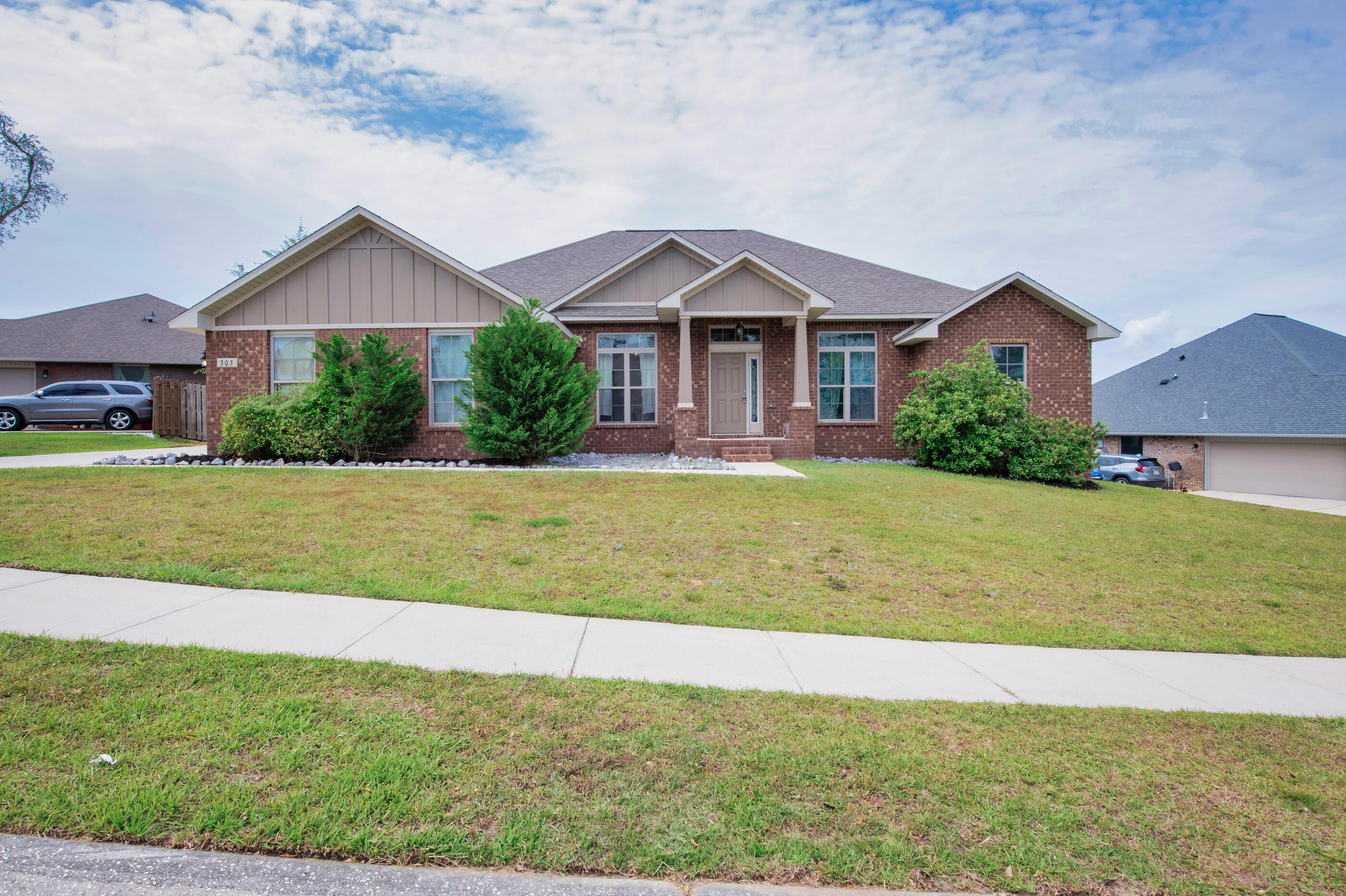 303 Vale Loop Crestview, FL 32536 - Photo 40 of 40 a front view of a house with a yard and garage