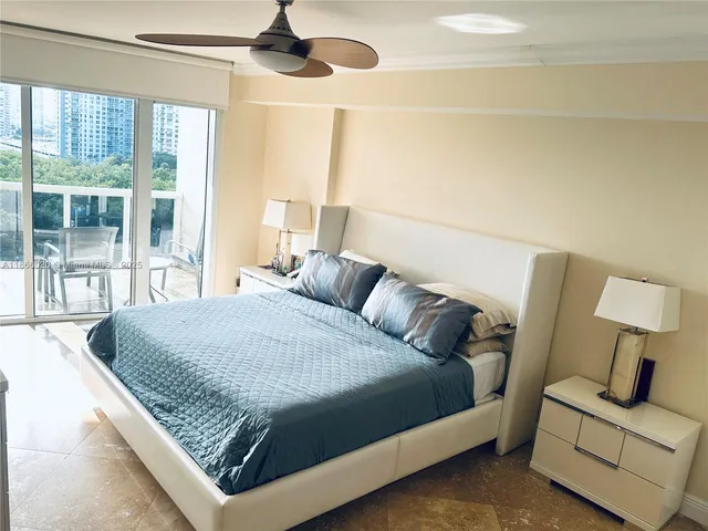 a spacious bathroom with a granite countertop sink and a mirror