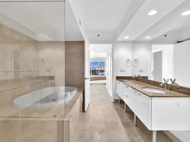 a bathroom with a shower and a bathtub