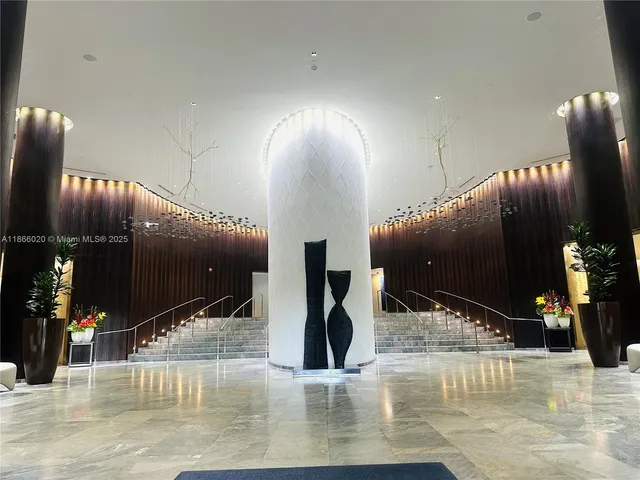 a lobby with entryway and furniture
