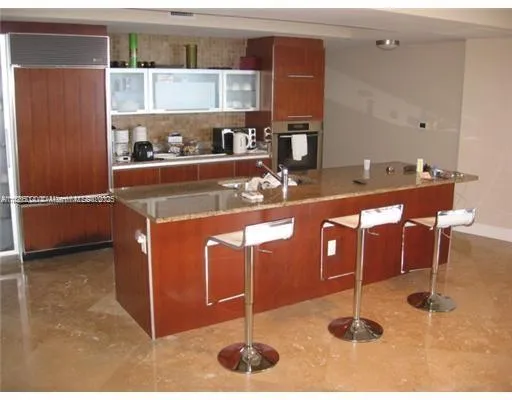 a room with a table chairs and projector room