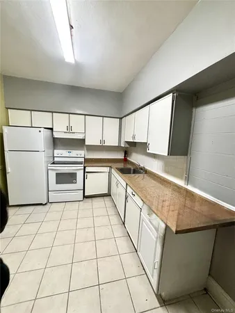 a kitchen with stainless steel appliances cabinets and a kitchen counter top