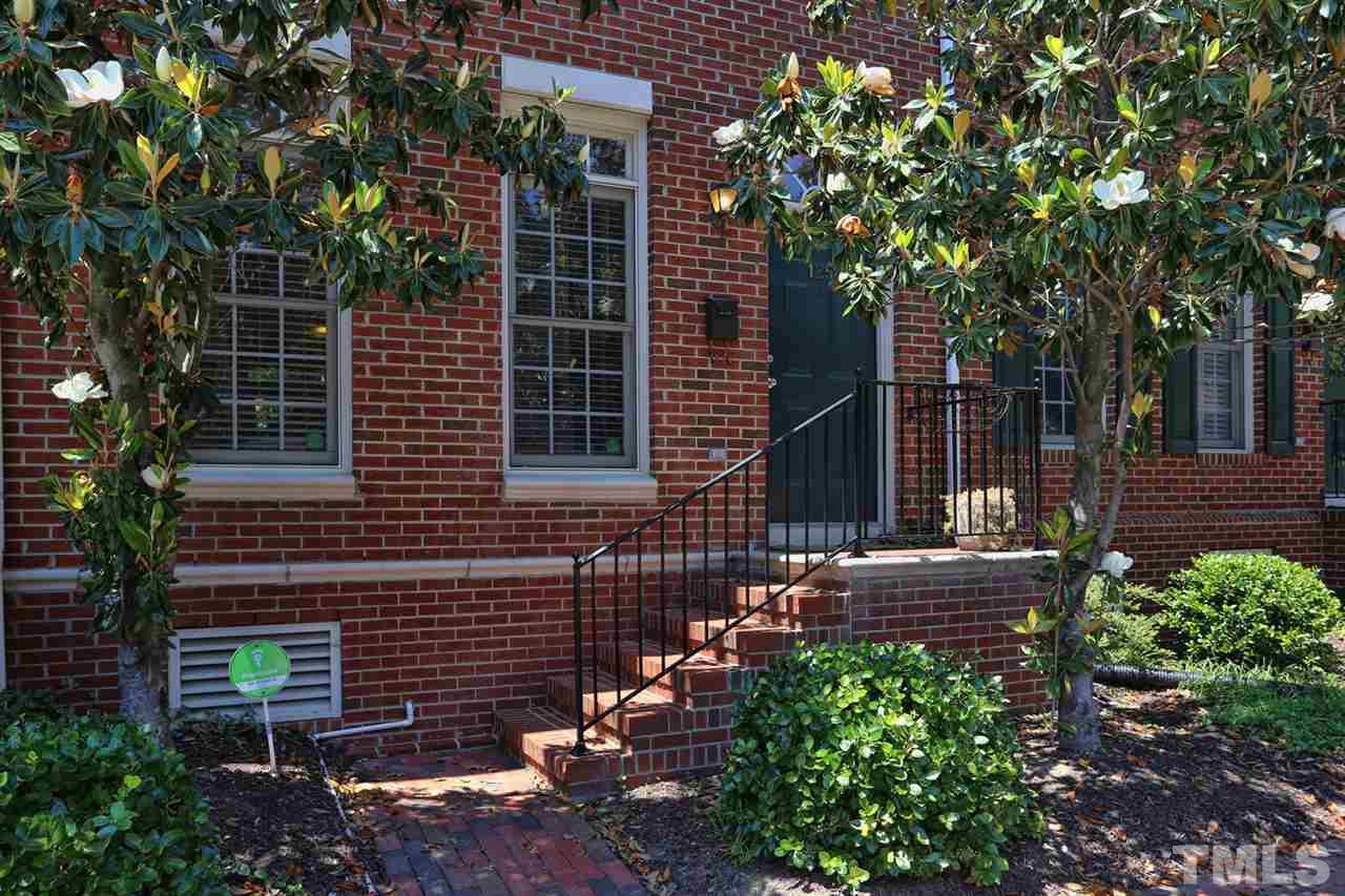 125 Fenner Lane Raleigh, NC 27603 - Photo 3 of 24 a backyard of a house with lots of green space