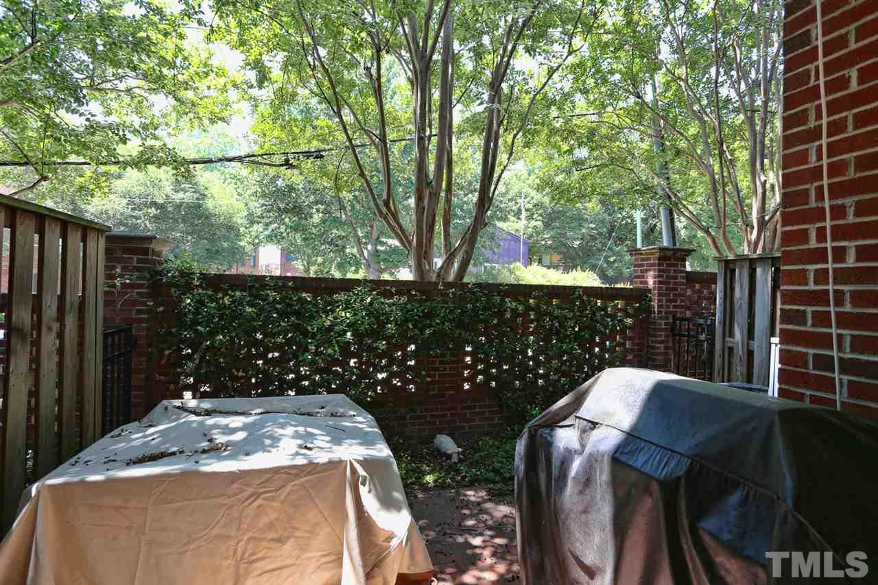 125 Fenner Lane Raleigh, NC 27603 - Photo 22 of 24 a wooden bench sitting in front of a house