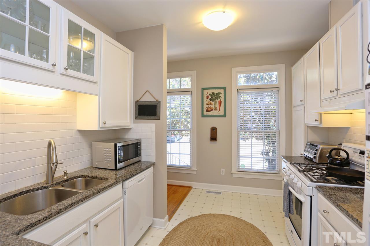 125 Fenner Lane Raleigh, NC 27603 - Photo 7 of 24 a kitchen with a sink stove and microwave