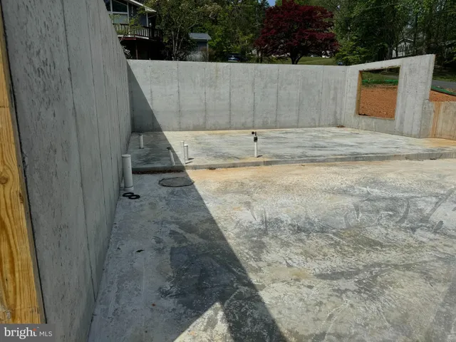 a bathroom with a wooden fence