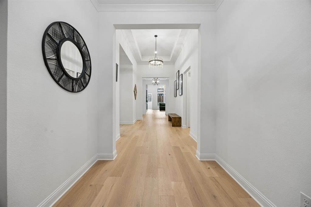 1717 Tolleson Drive Fort Worth, TX 76008 - Photo 3 of 40 a view of a hallway with wooden floor