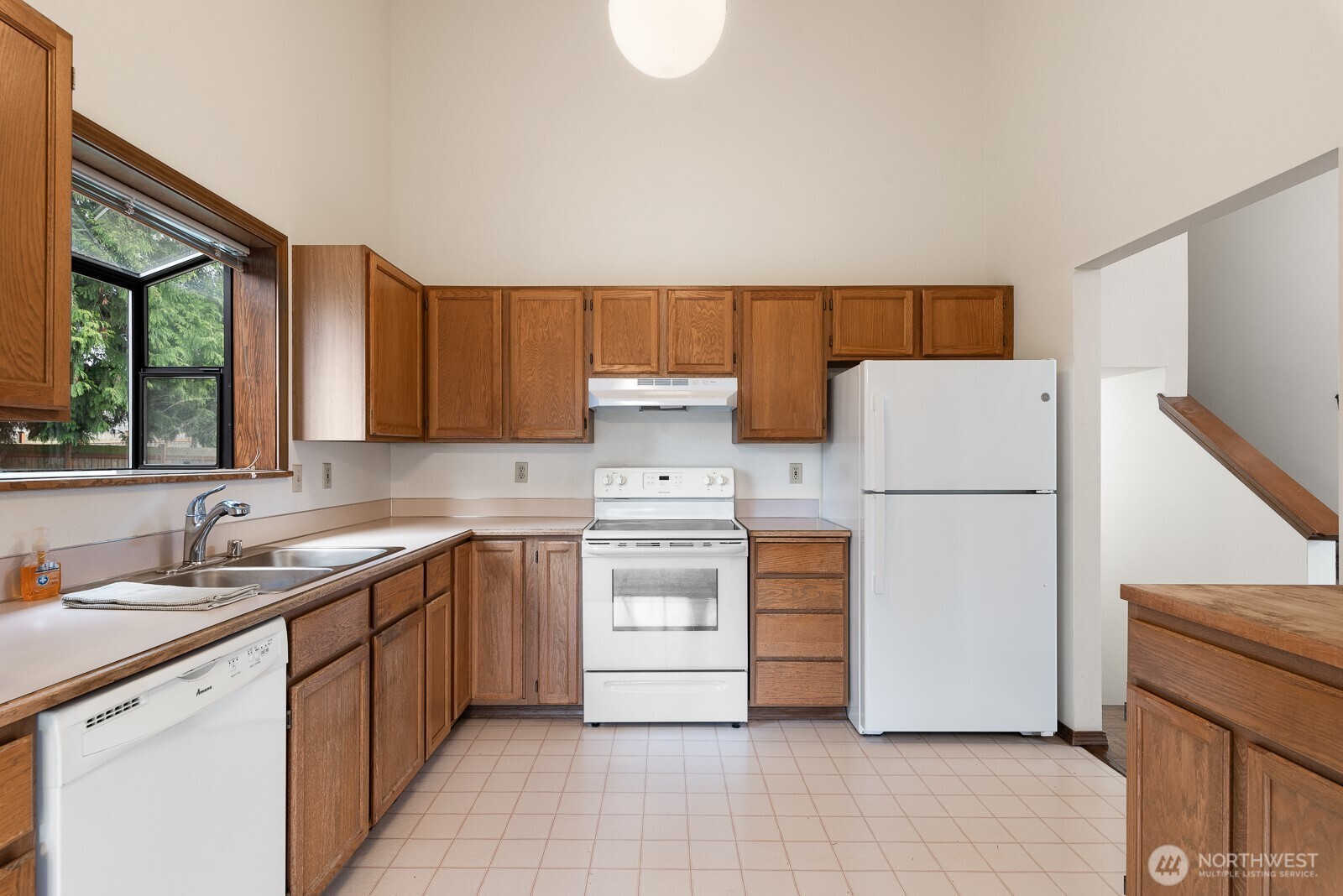 810 151st Street Southwest Lynnwood, WA 98087 - Photo 13 of 38 a kitchen with a refrigerator sink and cabinets