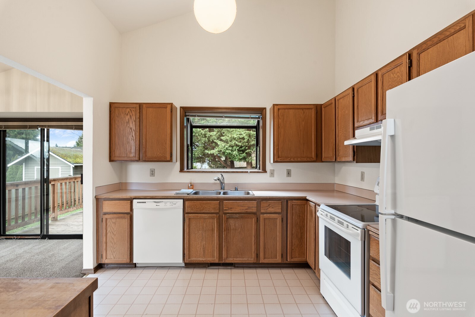810 151st Street Southwest Lynnwood, WA 98087 - Photo 14 of 38 a kitchen with a sink stove and cabinets