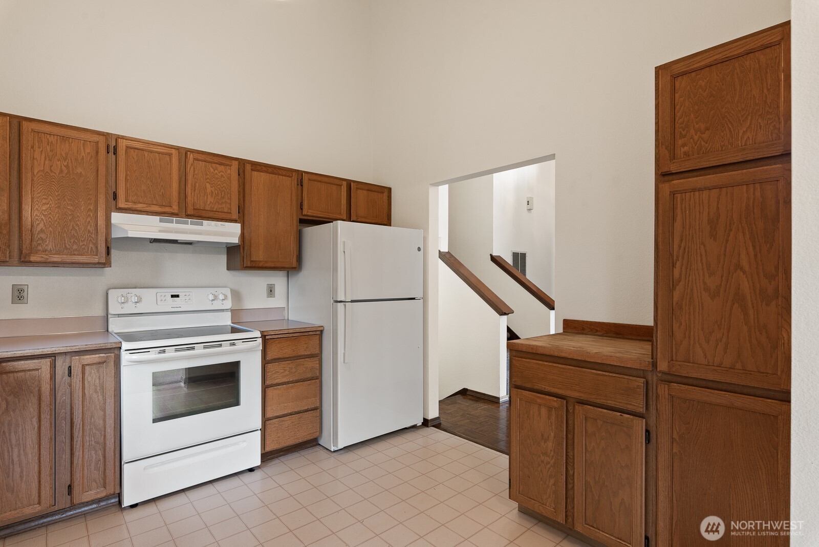 810 151st Street Southwest Lynnwood, WA 98087 - Photo 15 of 38 a kitchen with a refrigerator sink stove and cabinets