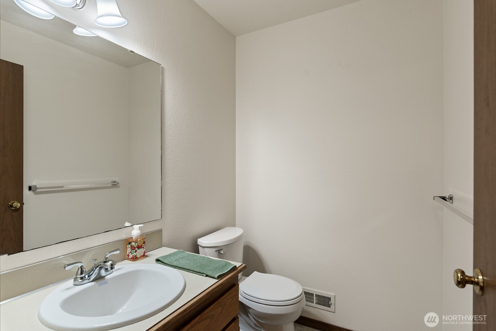 810 151st Street Southwest Lynnwood, WA 98087 - Photo 25 of 38 a bathroom with a granite countertop sink toilet and a mirror