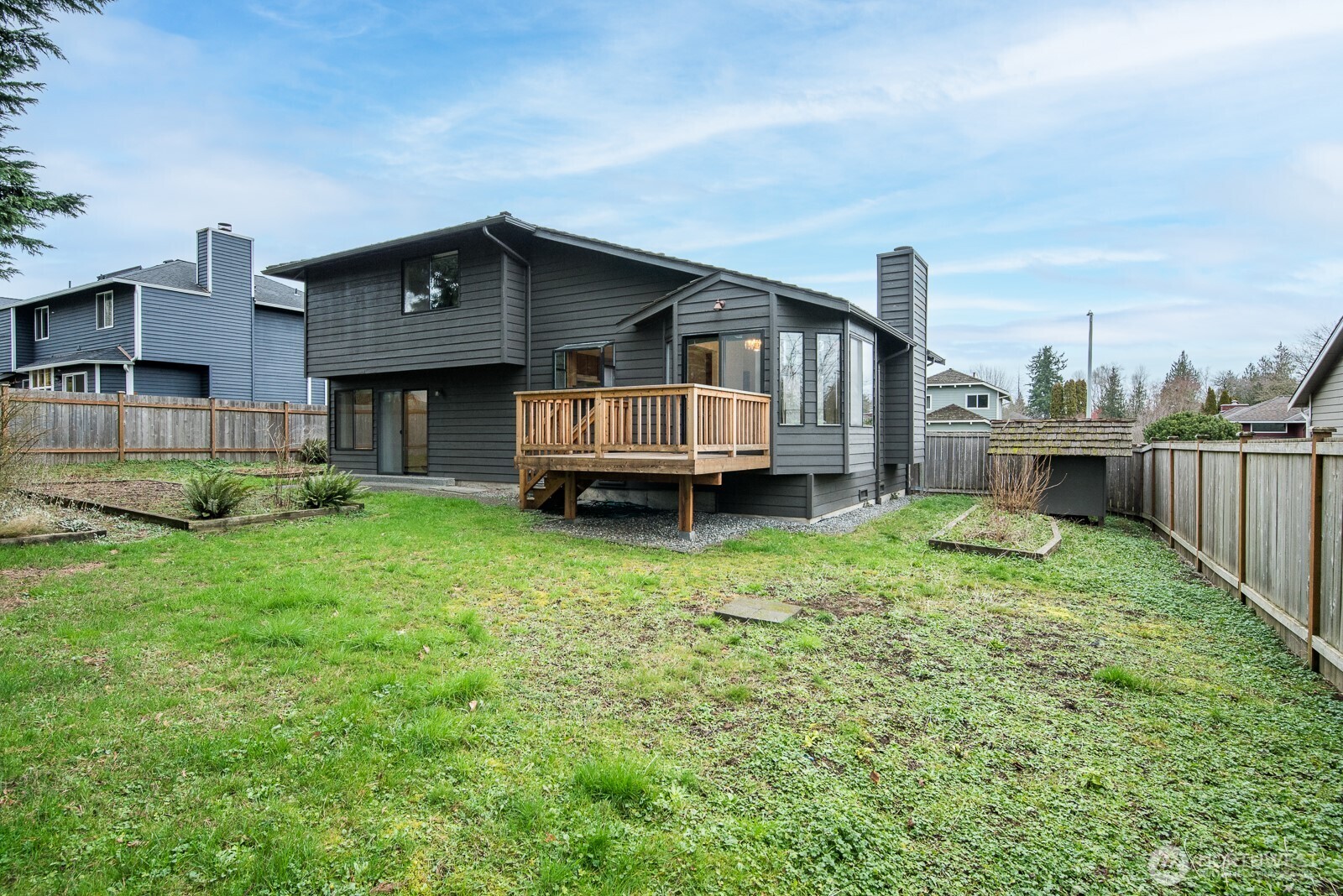 810 151st Street Southwest Lynnwood, WA 98087 - Photo 29 of 38 a view of a house with a backyard and deck