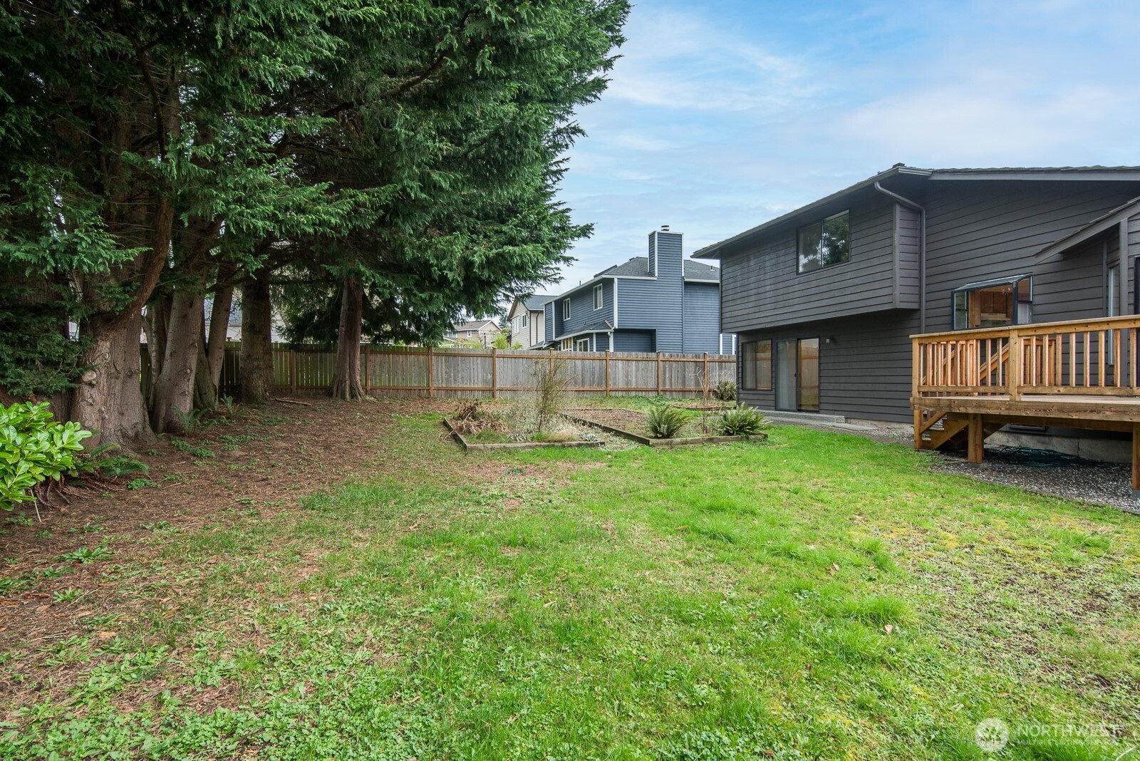 810 151st Street Southwest Lynnwood, WA 98087 - Photo 30 of 38 a view of a house with a backyard
