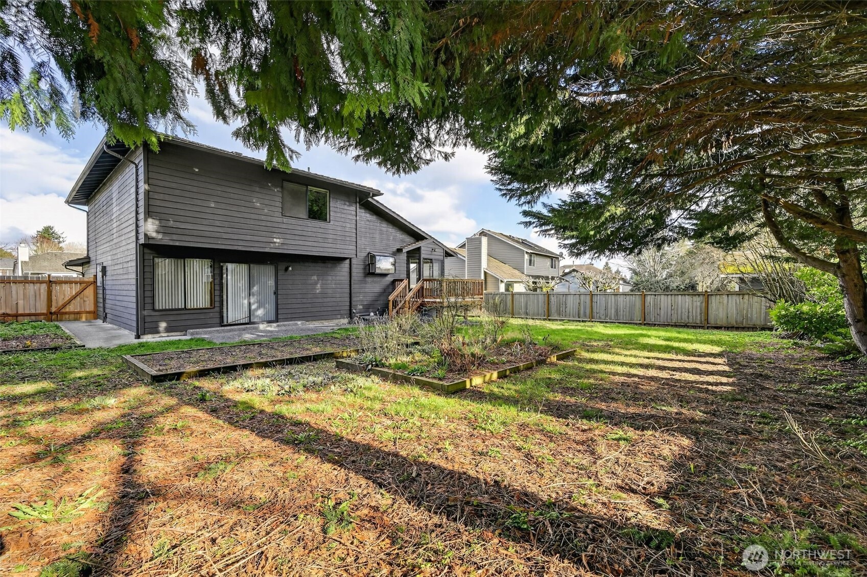 810 151st Street Southwest Lynnwood, WA 98087 - Photo 33 of 38 a view of a house with a yard