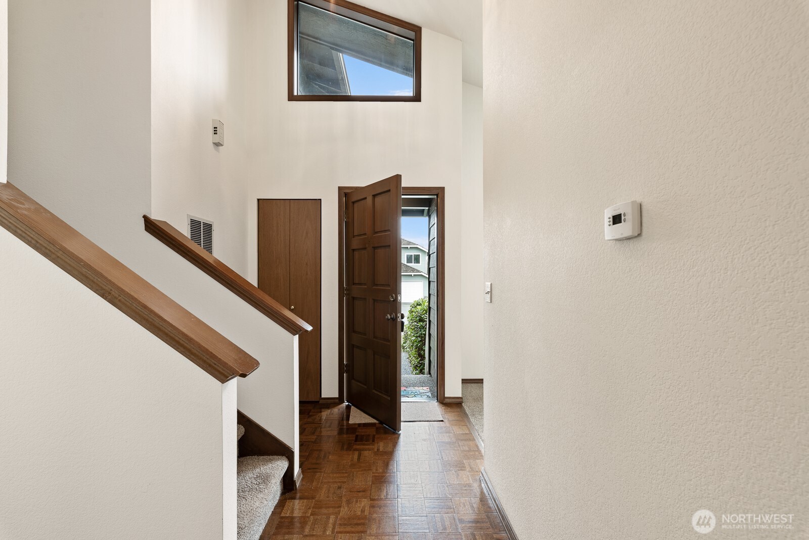 810 151st Street Southwest Lynnwood, WA 98087 - Photo 5 of 38 a view of a hallway with wooden floor and staircase