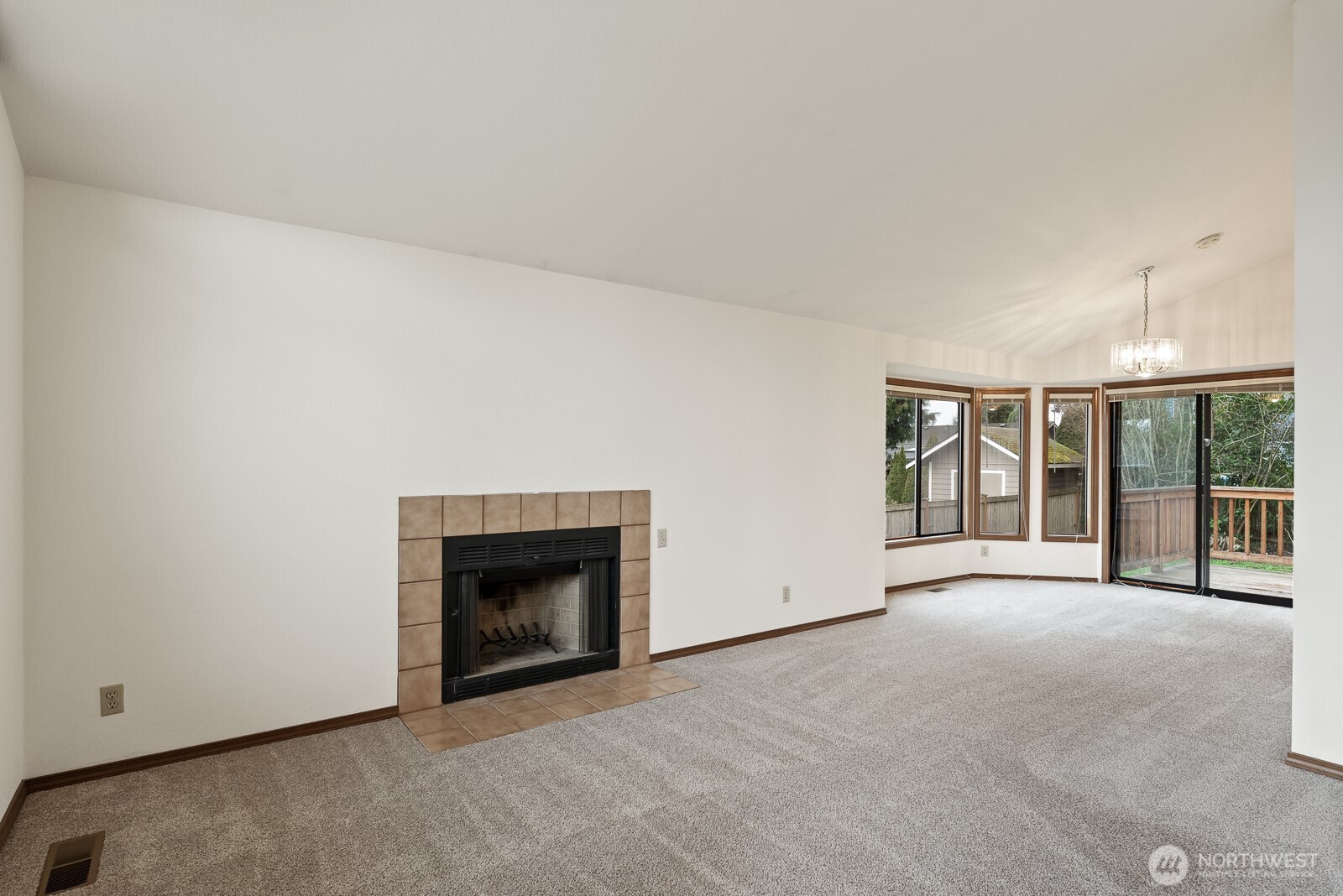 810 151st Street Southwest Lynnwood, WA 98087 - Photo 9 of 38 a view of an empty room with a fireplace and a window