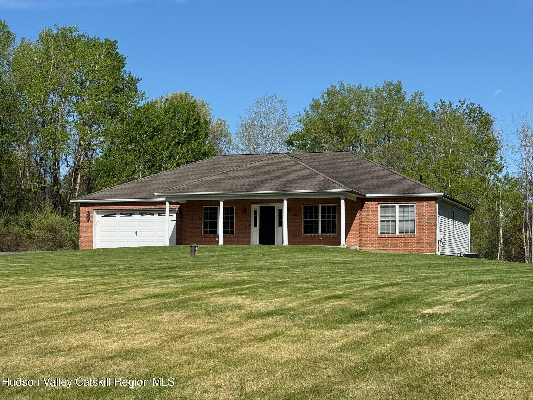24 Mountain View Road Amenia, NY 12501 - Photo 1 of 13 a house that has a tree in front of it