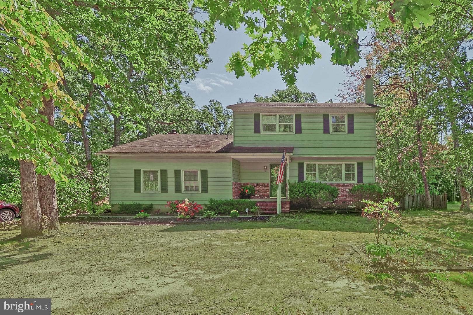 204 Ridge Road Southampton, NJ 08088 - Photo 1 of 36 a front view of a house with garden