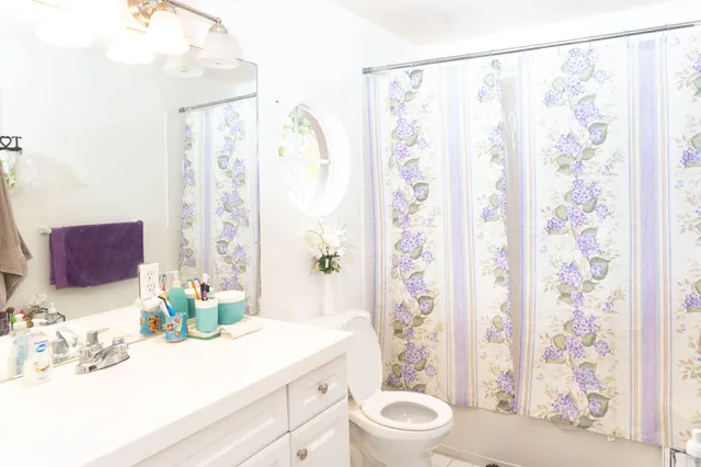 a view of a room with furniture and chandelier