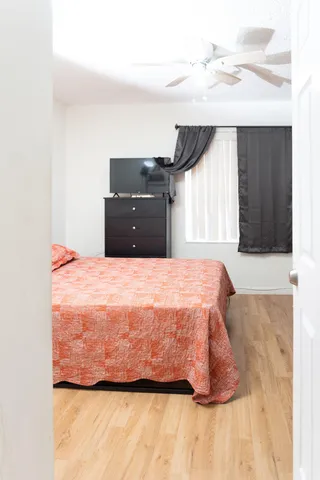 a bathroom with a shower a toilet and a sink