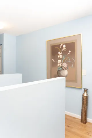 a bathroom with a toilet and a shower curtain