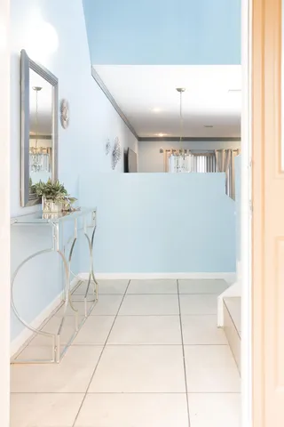 a living room with hard wood flooring and furniture