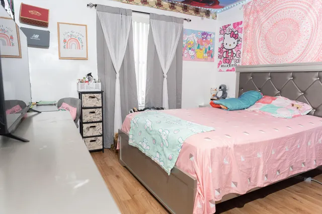 a view of a house with a tree