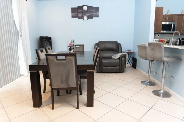 a view of a field of grass and trees