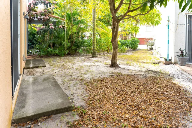 a view of a yard with an outdoor seating