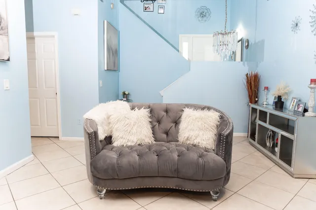 a bedroom with a bed and white walls