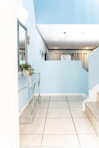 a kitchen with stainless steel appliances granite countertop a refrigerator a stove a sink dishwasher and a refrigerator with wooden floor