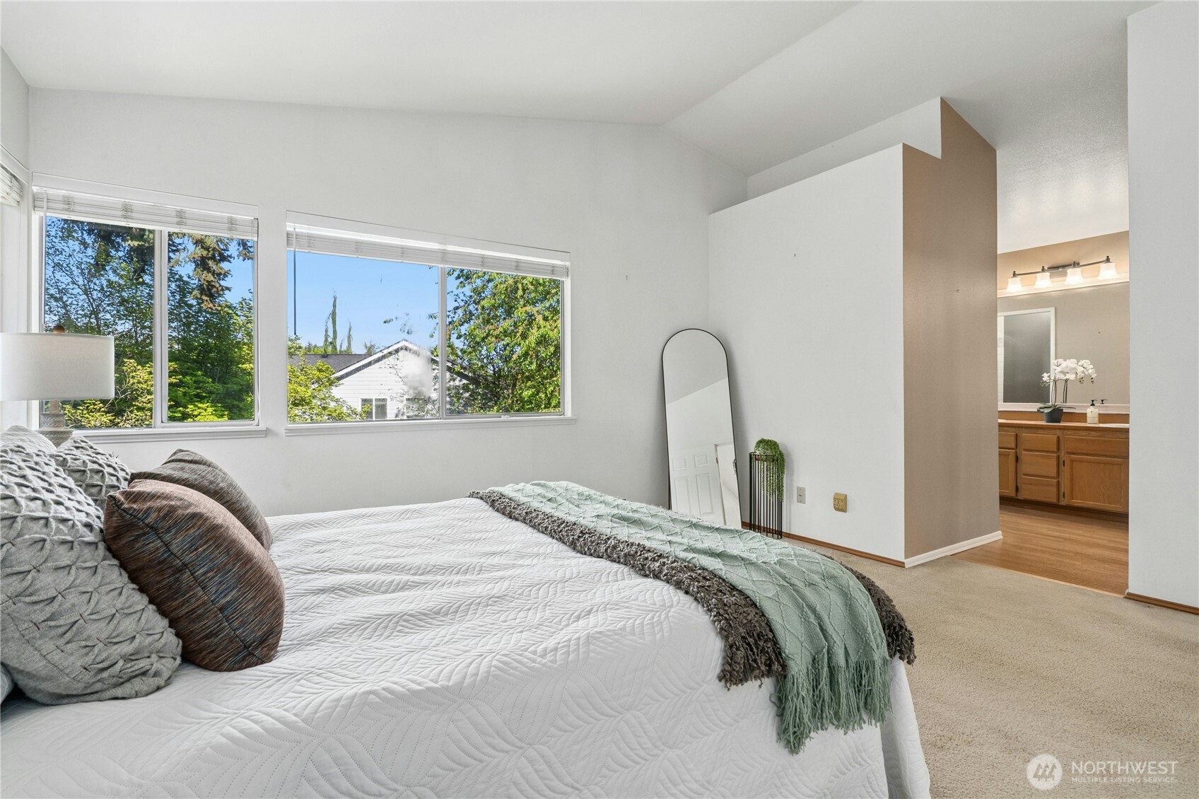 12818 Northeast 203rd Place Bothell, WA 98011 - Photo 15 of 36 a bedroom with a bed and a large window