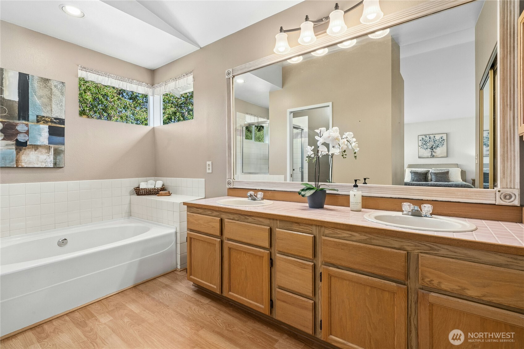 12818 Northeast 203rd Place Bothell, WA 98011 - Photo 16 of 36 a bathroom with a tub a sink and mirror