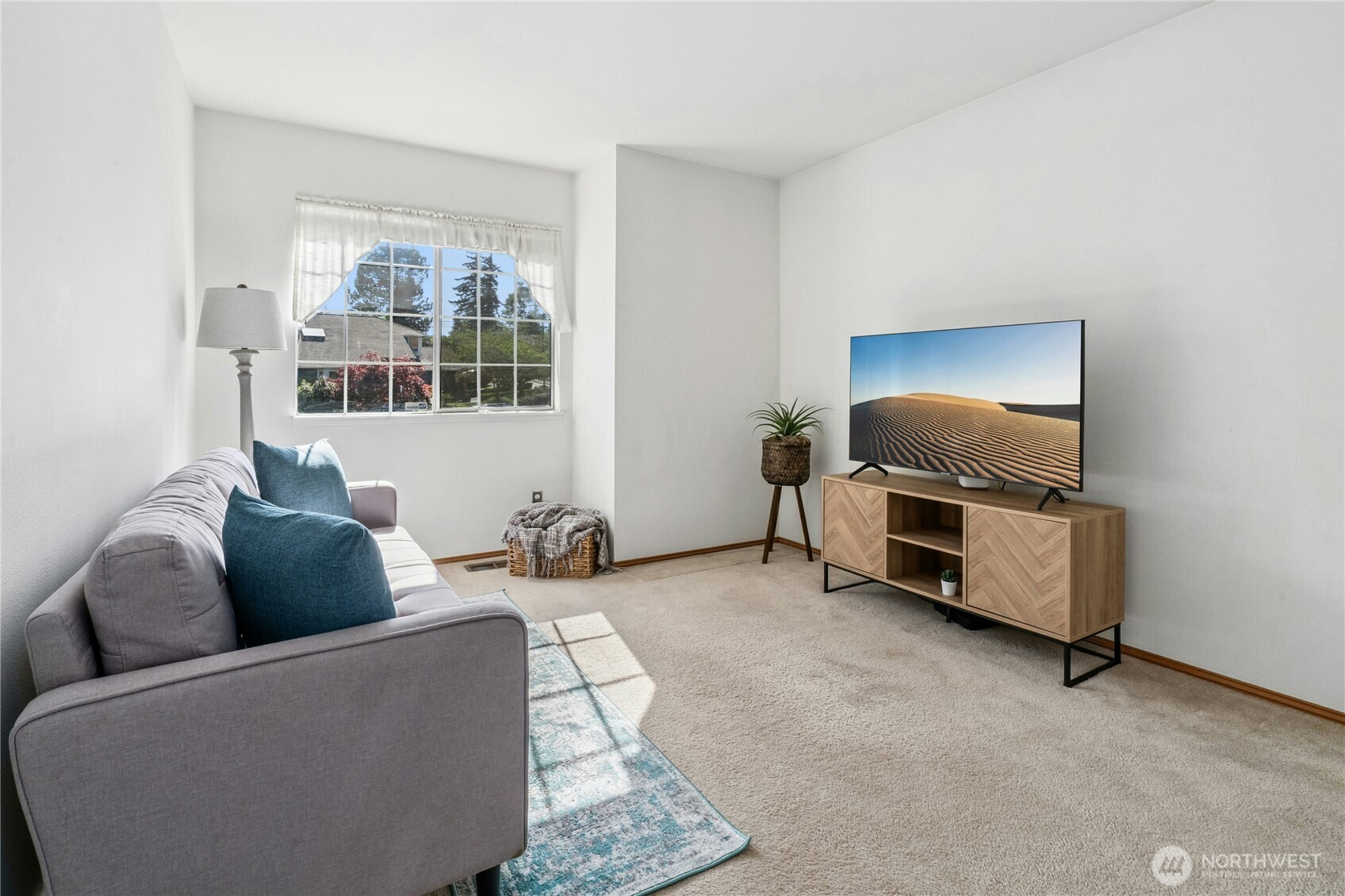 12818 Northeast 203rd Place Bothell, WA 98011 - Photo 19 of 36 a living room with furniture and a window
