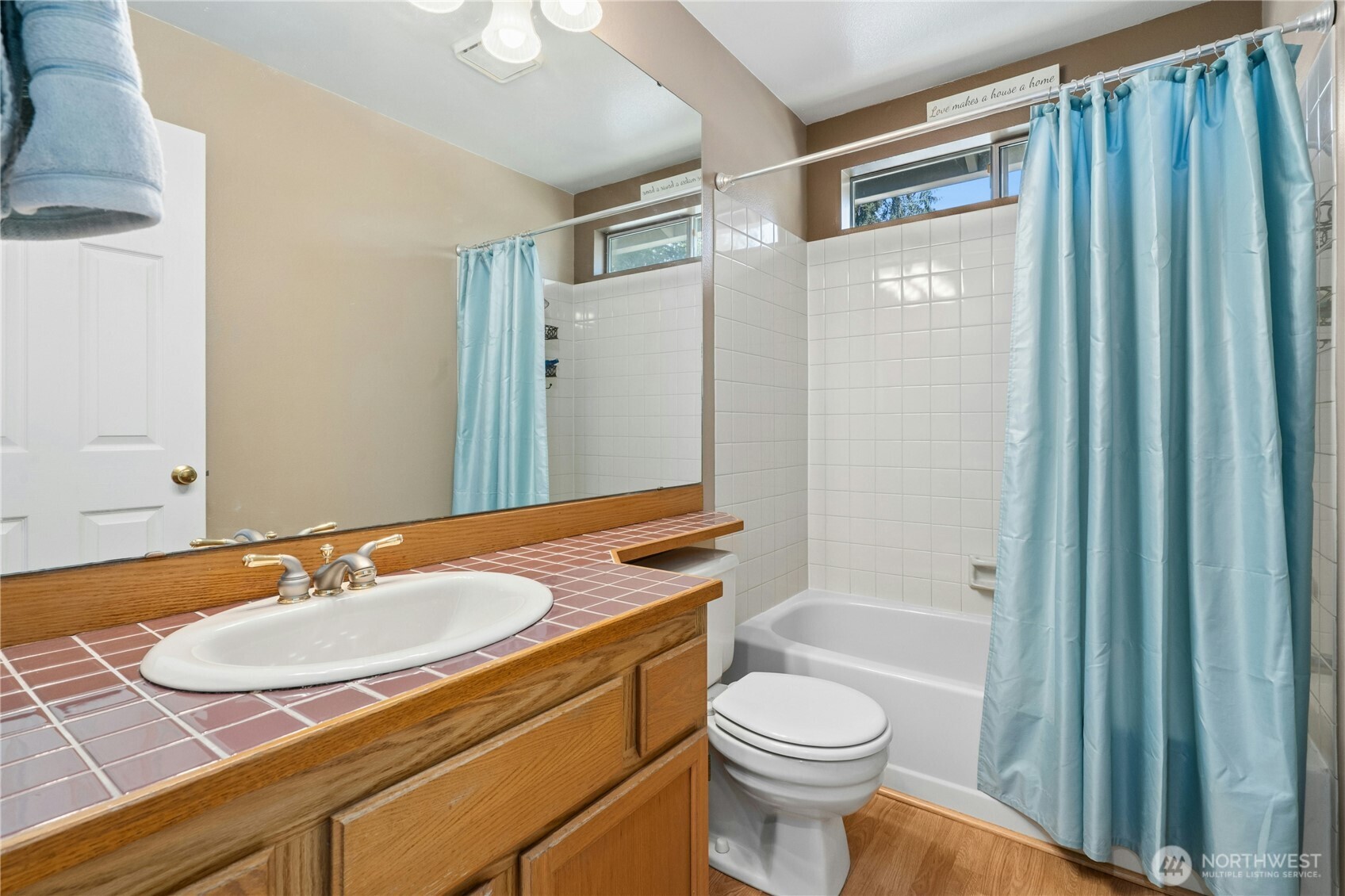 12818 Northeast 203rd Place Bothell, WA 98011 - Photo 21 of 36 a bathroom with a granite countertop sink toilet and shower