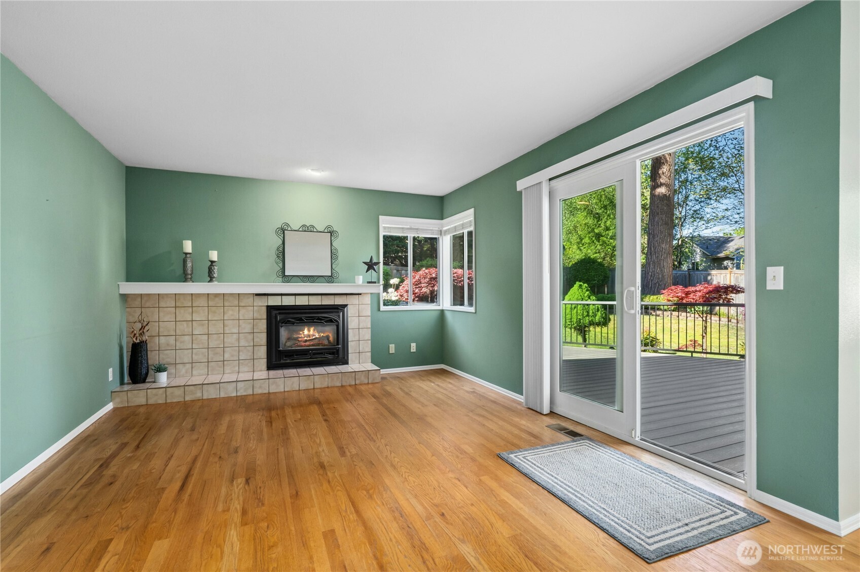 12818 Northeast 203rd Place Bothell, WA 98011 - Photo 24 of 36 a view of an empty room with a fireplace and a window