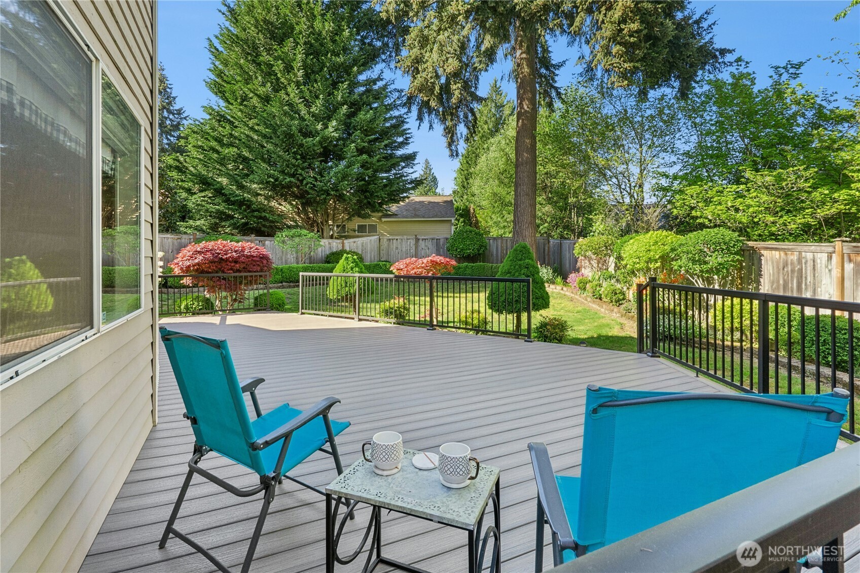 12818 Northeast 203rd Place Bothell, WA 98011 - Photo 26 of 36 a patio with table and chairs