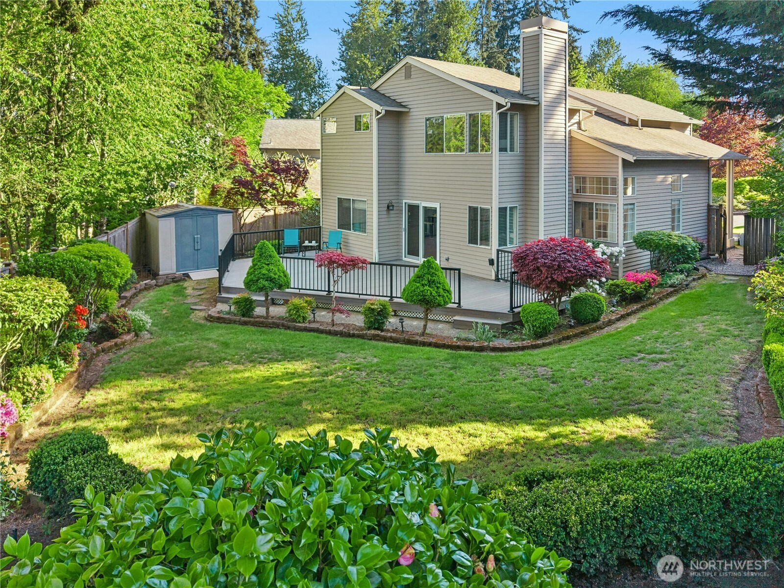 12818 Northeast 203rd Place Bothell, WA 98011 - Photo 27 of 36 a front view of a house with a garden and plants