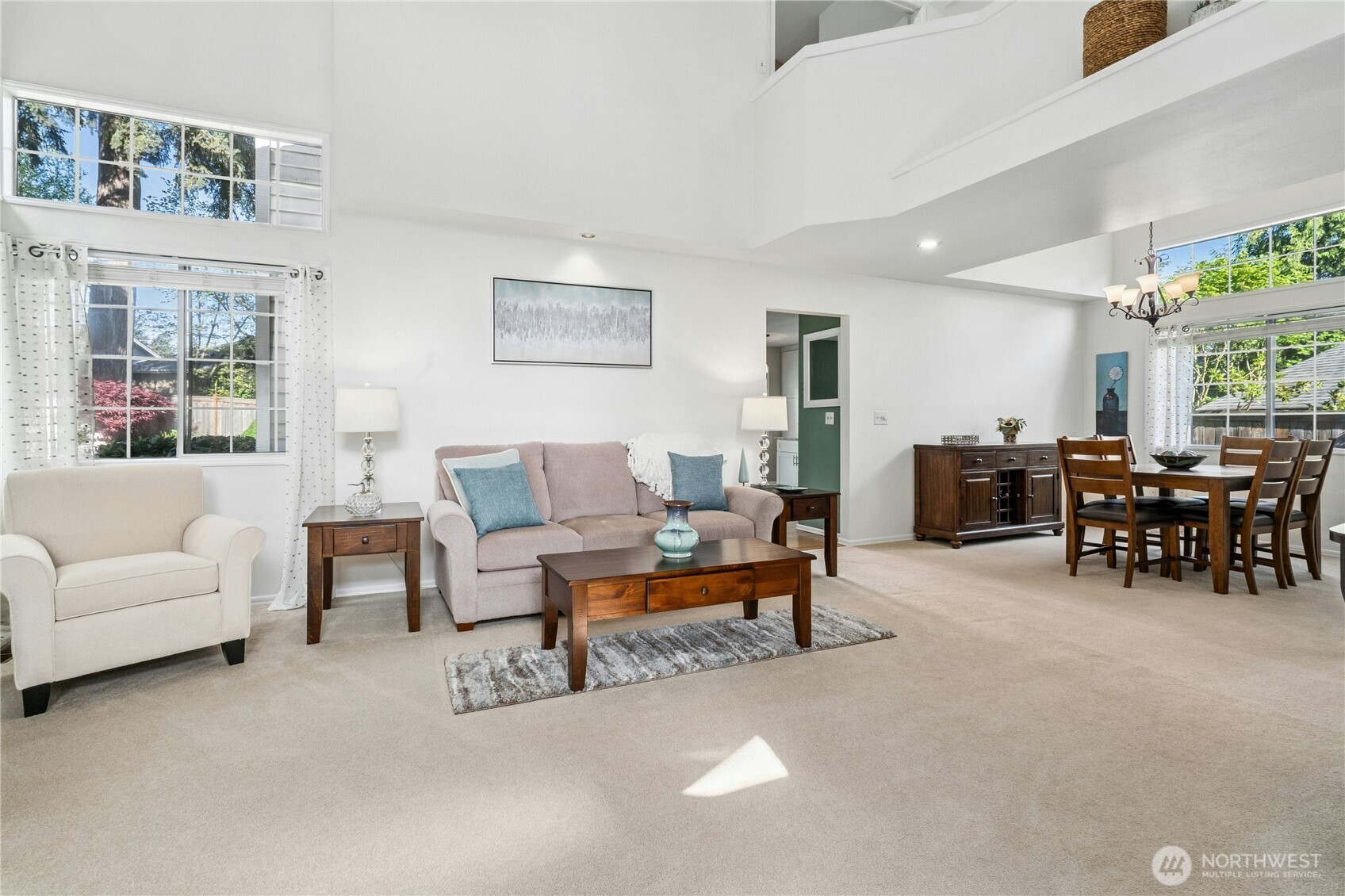 12818 Northeast 203rd Place Bothell, WA 98011 - Photo 4 of 36 a living room with furniture and a large window