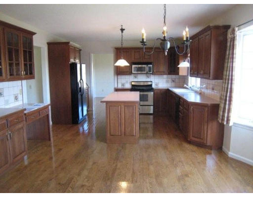 5 Ridge Road Hampden, MA 01036 - Photo 18 of 27 a large kitchen with a table and chairs