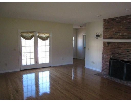 5 Ridge Road Hampden, MA 01036 - Photo 19 of 27 a view of empty room with wooden floor and fireplace