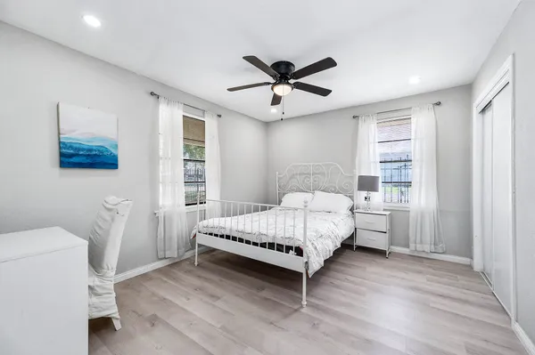 a bedroom with a bed and a window