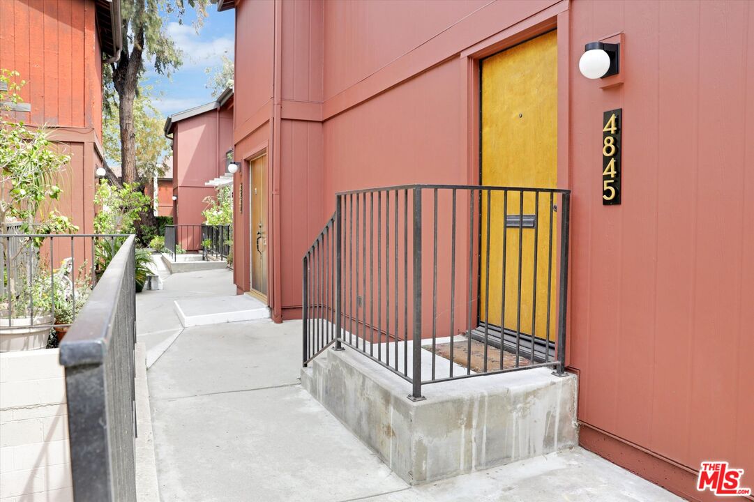 a view of a porch with wooden floor