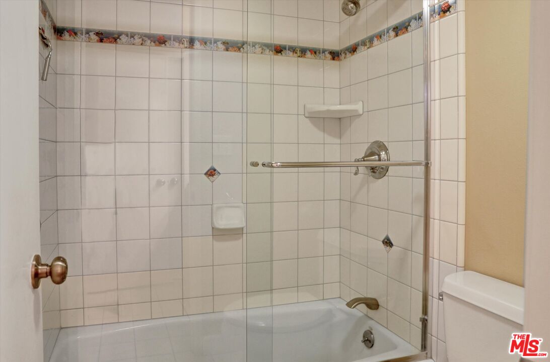 4845 Maytime Lane Culver City, CA 90230 - Photo 20 of 20 a bathroom with a shower and a bathtub