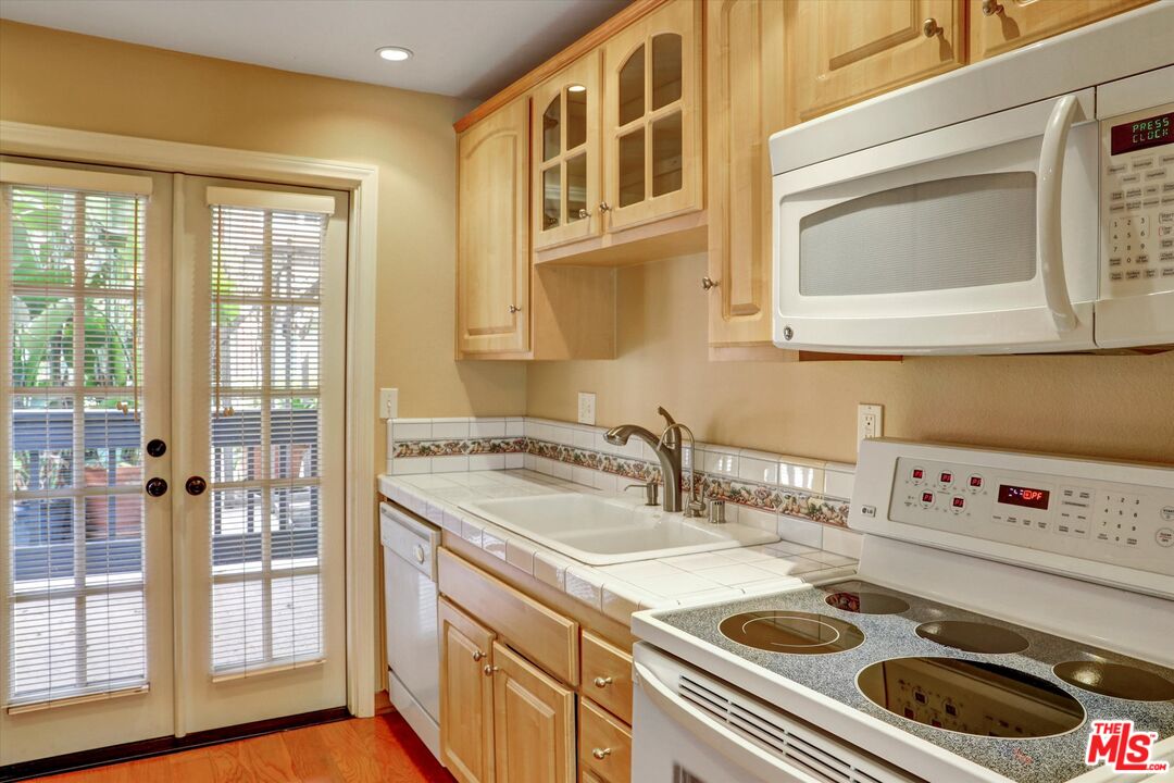 4845 Maytime Lane Culver City, CA 90230 - Photo 8 of 20 a kitchen with a stove a sink and a microwave