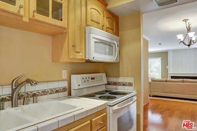 a kitchen with a stove and a sink