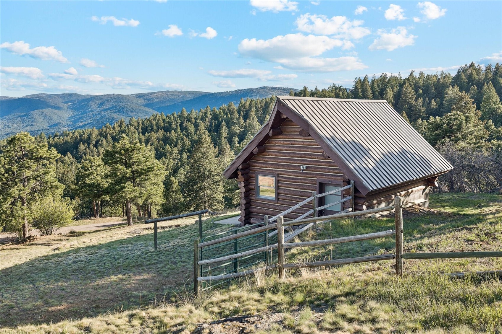 51 West Ranch Trail Morrison, CO 80465 - Photo 48 of 50 a view of a house with a yard