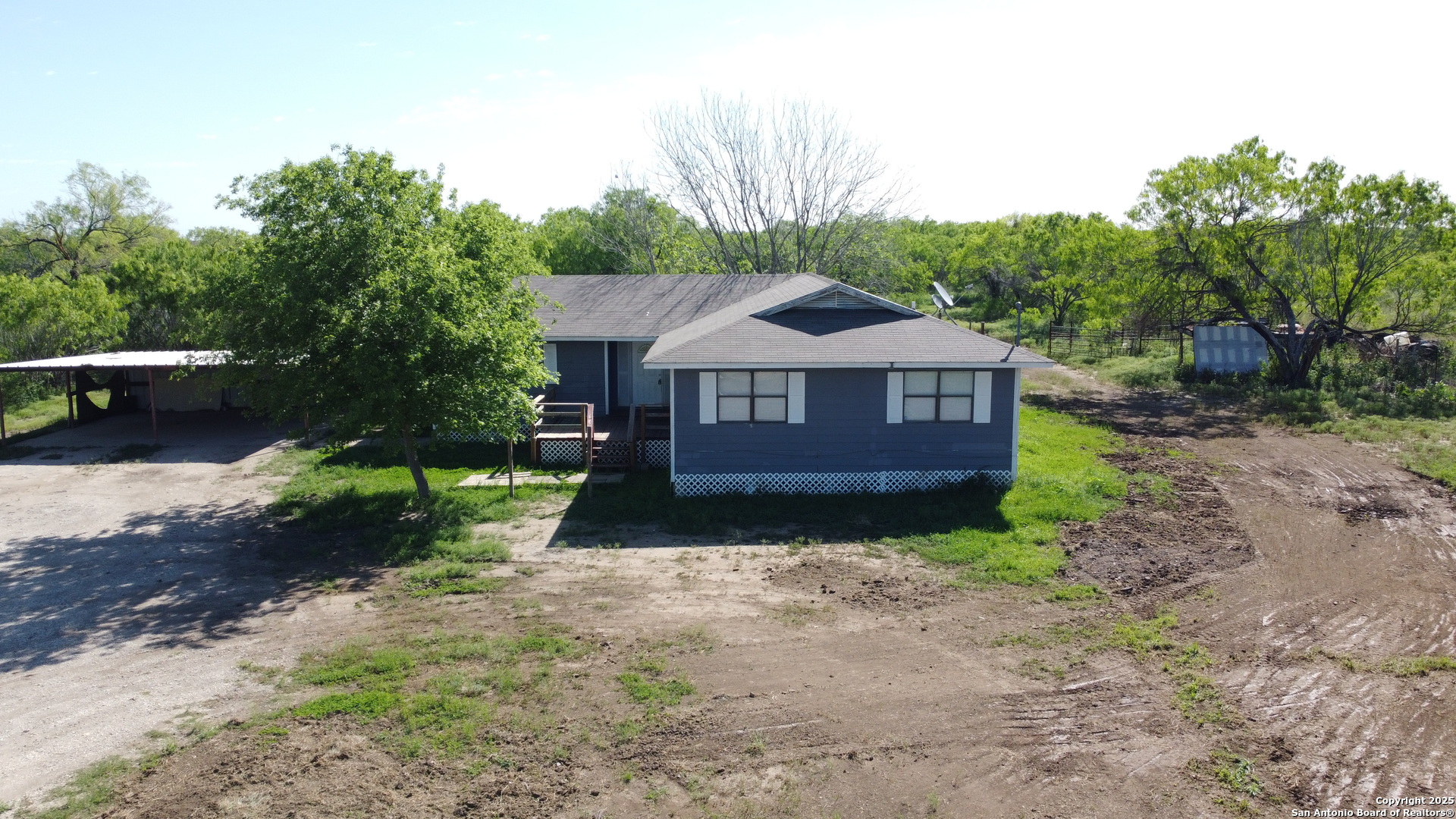 18234 Benton City Road Von Ormy, TX 78073 - Photo 1 of 25 a view of front of a house with a yard