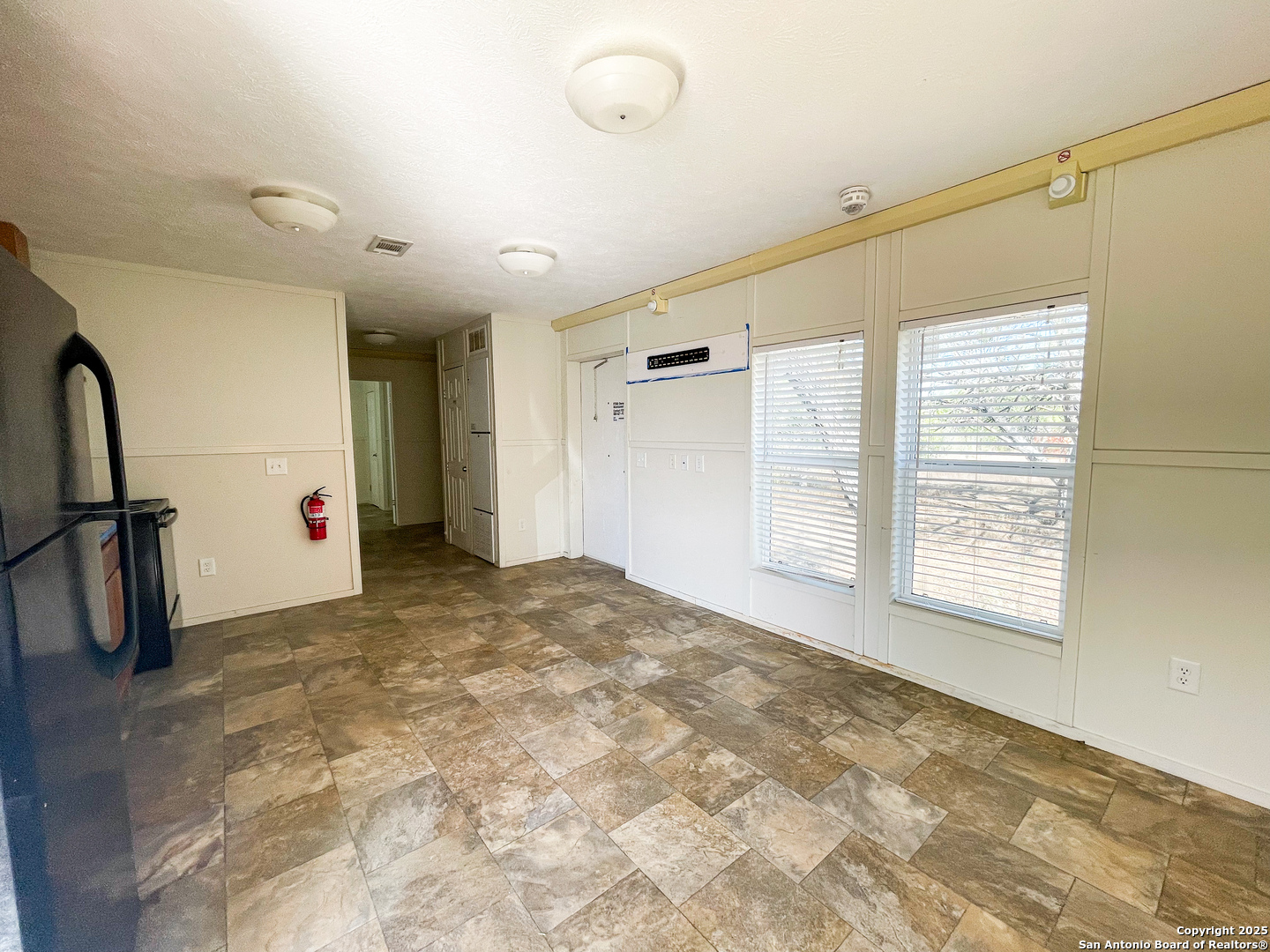 18234 Benton City Road Von Ormy, TX 78073 - Photo 11 of 25 a view of a livingroom with a staircase