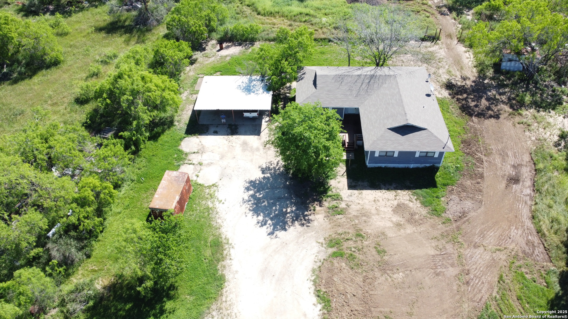 18234 Benton City Road Von Ormy, TX 78073 - Photo 23 of 25 an aerial view of a house with a yard